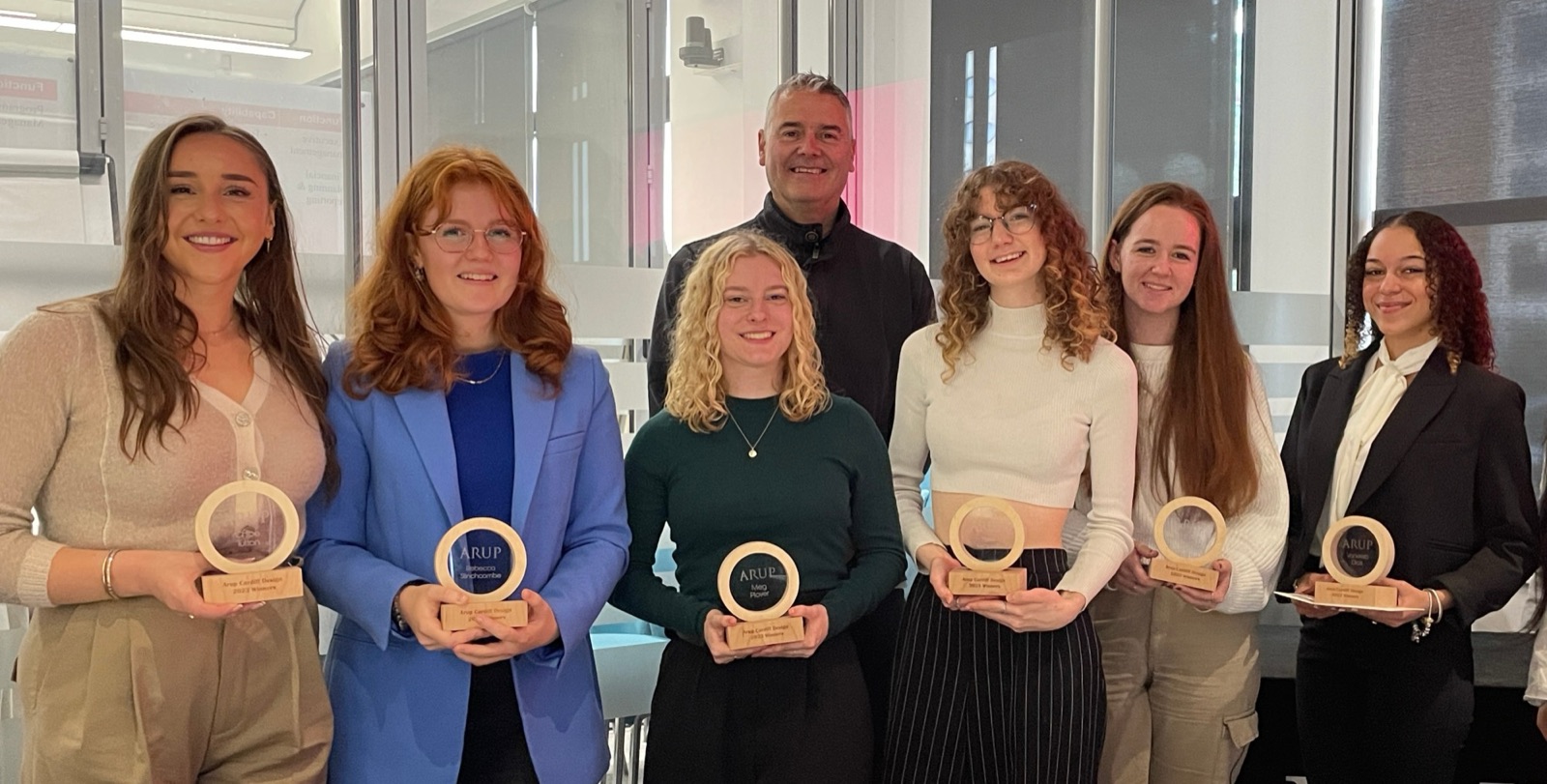 Dr Craig Thomas with students holding their Arup Cardiff Design awards