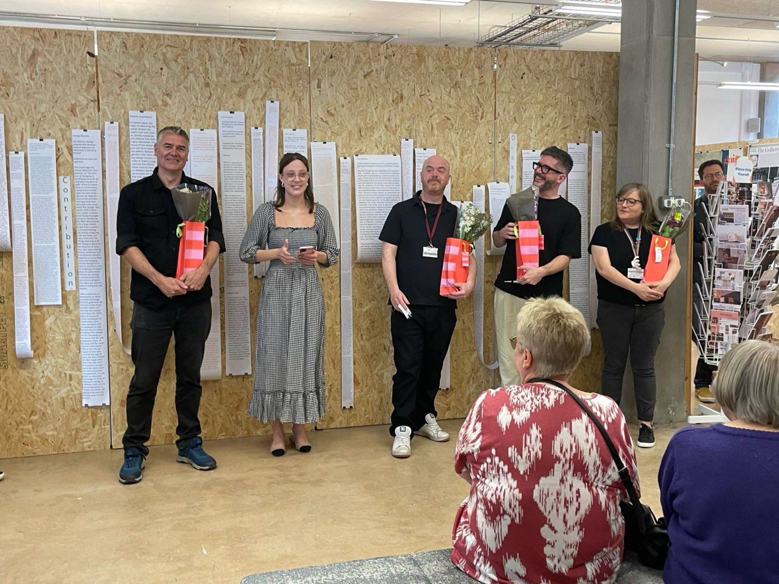 Dr Craig Thomas and colleagues being recognised at a student exhibition