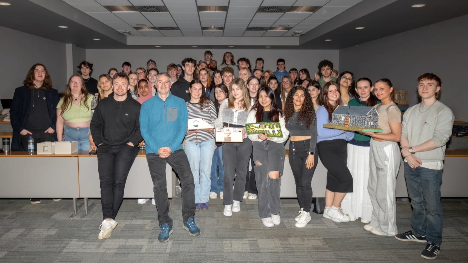 Dr Craig Thomas with interior design students and their models